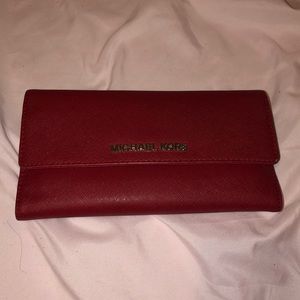 Michael Kors red wallet plenty of room many pockets